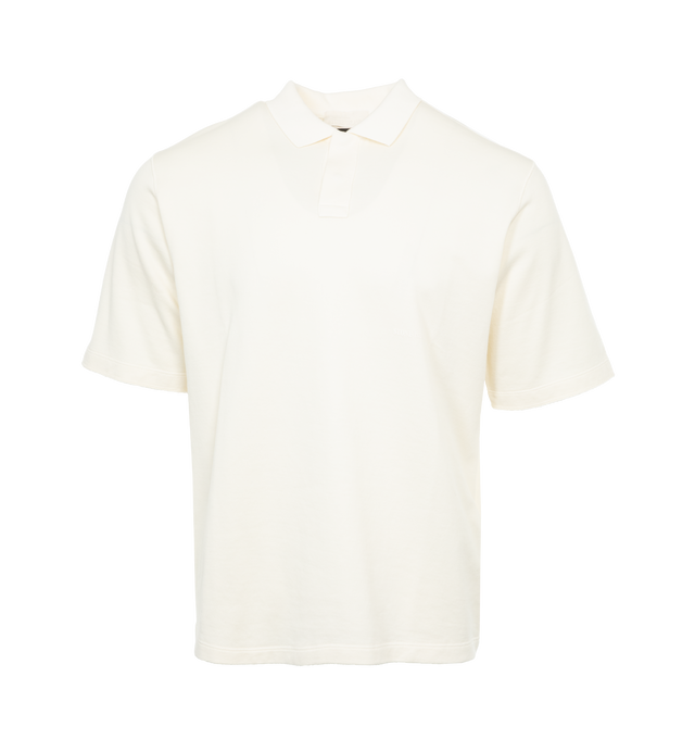 Image 1 of 3 - WHITE - STONE ISLAND Ghost Polo Shirt featuring regular fit, ribbed collar with hidden two-snap fastening, small tone-on-tone Stone Island lettering print low on chest and raw-edged finish on sleeves. 100% cotton. 