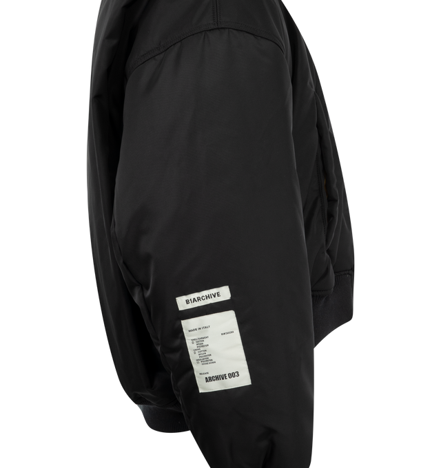 Image 4 of 4 - BLACK - B1 ARCHIVE Cropped Bomber featuring oversized fit, cropped length, stand collar, front zip closure and zip sleeve pocket. 100% polyester.  