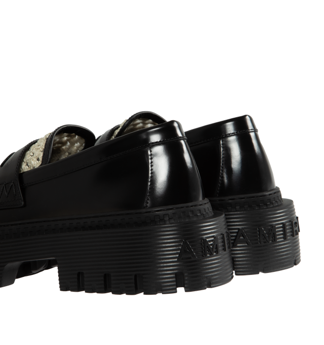 Image 3 of 4 - BLACK - AMIRI Jumbo Mixed Media Penny Loafer featuring superchunky lug sole with ridged texture, textured knit vamp and monogram-logo 'coin' in the keeper strap. Leather and textile upper/textile lining/rubber sole. Made in Italy. 