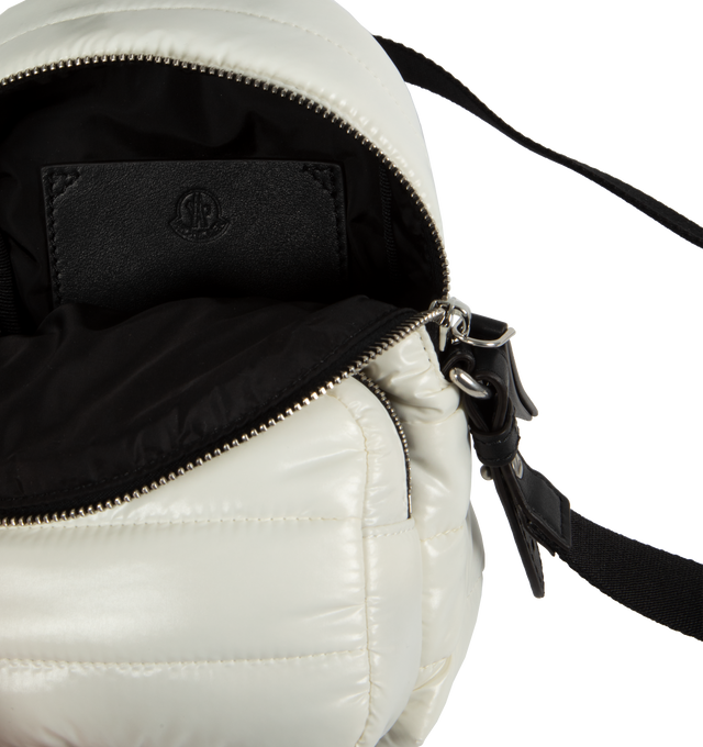 Image 3 of 3 - WHITE - MONCLER Small Kilia Cross Body Bag featuring water-repellent nylon lining, padded, leather handle, detachable shoulder strap, zipper closure, front zipped pocket, flat interior leather pocket, leather detailing and leather and metal logo. L 18 cm x H 15 cm x D 11 cm. 100% polyamide/nylon. Padding: 100% polyester. 