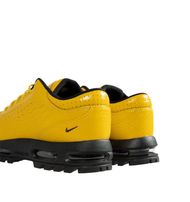 Image 3 of 5 - YELLOW - Nike Air Max Goadome Low Croc Sneakers are crafted from premium leather upper, a padded collar, perforated accents, debossed branding at the tongue, and an embossed Swoosh at the ankle. Finished with visible Nike Air cushioning and a lugged rubber outsole for enhanced traction, the Air Max Goadome Low blends trail-ready durability with everyday wearability. Main Material: Leather Upper. Cushioning: Nike Air with Visible Air Unit. Outsole: Lugged Rubber.  