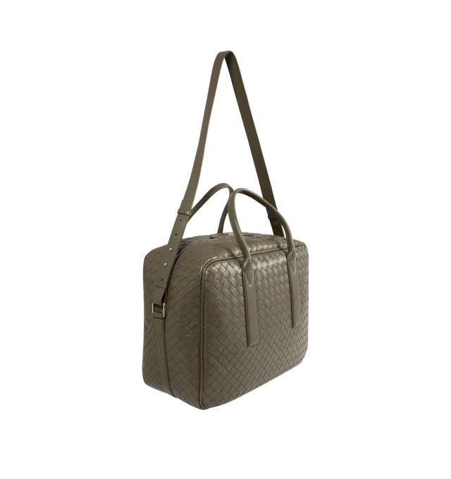 Image 2 of 3 - GREEN - BOTTEGA VENETA Getaway Weekender featuring soft Intrecciato leather with adjustable and detachable strap, signature knot detail, padded laptop compartment, one zipped pocket and zipper closure. Lining: canvas. 13" x 16.9" x 7.5". Handle drop: 6.5". Calfskin. Made in Italy.  