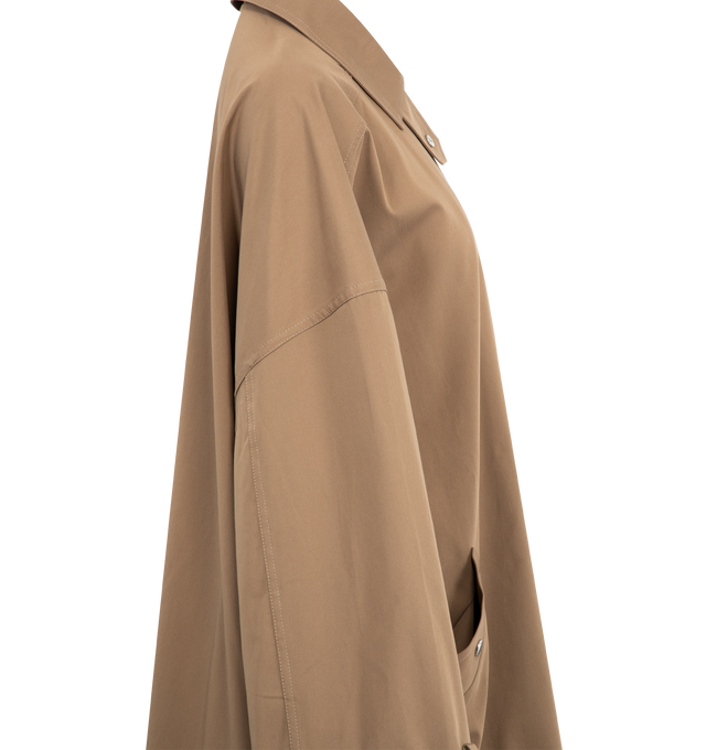 Image 4 of 4 - BROWN - TOTEME Oversized Trench Jacket with subtle trench coat accents featuring relaxed A-line silhouette, slanted pockets, adjustable cuff belts, a zipped front and snap buttons. 100% cotton organic. 