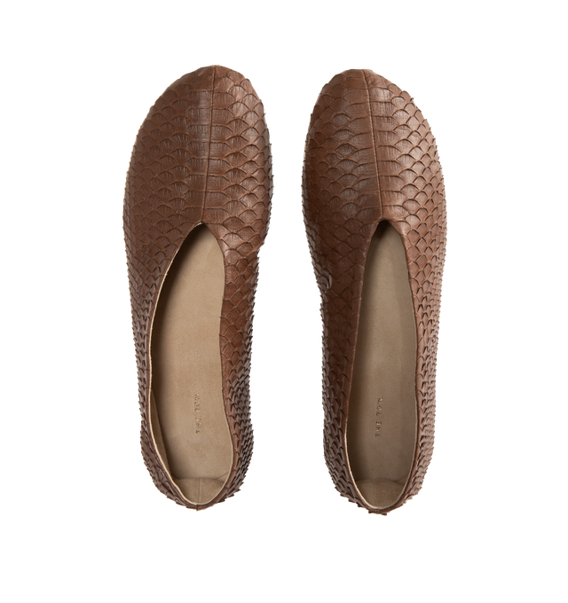 Image 4 of 4 - BROWN - The Row mousse brown slip-on flat with an oval toe, center front seam, and a flexible rubber-coated sole in textured python leather. Python leather with goat leather lining and rubber sole. Made in Italy. 