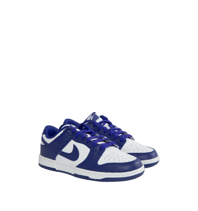 Image 2 of 5 - PURPLE - Nike Dunk Low Sneakers with white and concord purple color-blocking,  a padded, low-cut collar, leather upper with a slight sheen and durability, foam midsole offering lightweight, responsive cushioning. Perforations on the toe add breathability. Rubber sole with classic hoops pivot circle provides durability and traction.  