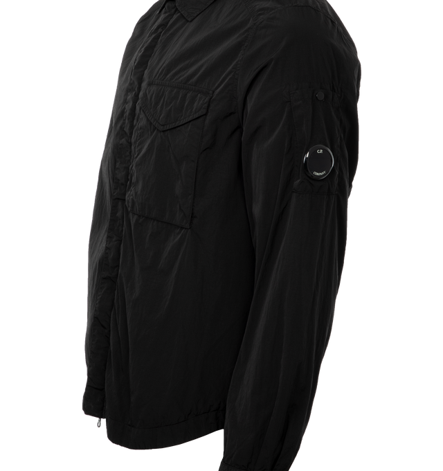 Image 3 of 3 - BLACK - C.P. COMPANY Chrome-R Lens Overshirt featuring classic collar, hidden two-way zip fastening with button closure, flap chest pocket, lens detail, adjustable flap cuffs, garment dyed, cotton lining and regular fit. 100% polyamide/nylon. 