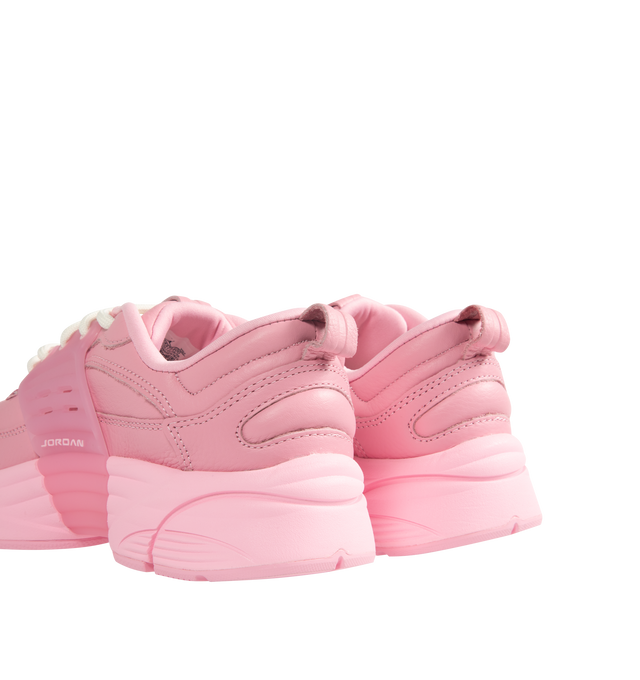 Image 3 of 5 - PINK - Men's Jordan Trunner O/S SP Sneakers feature a leather upper with synthetic overlays, molded midfoot support wings, and signature Jordan branding for a modern athletic look. These lifestyle sneakers combine responsive Cushlon 3.0 foam cushioning, a lightweight foam midsole, and a durable rubber outsole for exceptional comfort, stability, and everyday traction. Main Material: Leather and Synthetic. Midsole: Foam with Cushlon 3.0 Cushioning. Sole: Rubber. 