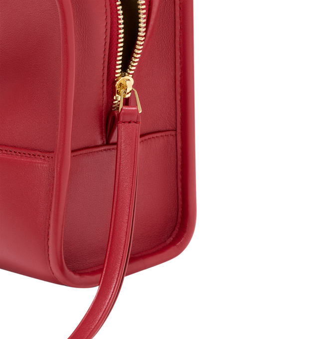 Image 13 of 18 - RED - Loewe Small Amazona 180 Bag in leather features a relaxed silhouette anchored by a single toron top handle, designed to be carried open, while a concealed closure secures the main compartment, three carry options: short handle, removable shoulder strap and crossbody, zip closure with two leather zip pullers, two compartments, main compartment closed with magnetic closure, internal flat pocket, left side d-ring for customization, nappa lambskin lining, and embossed double L branding. L 
