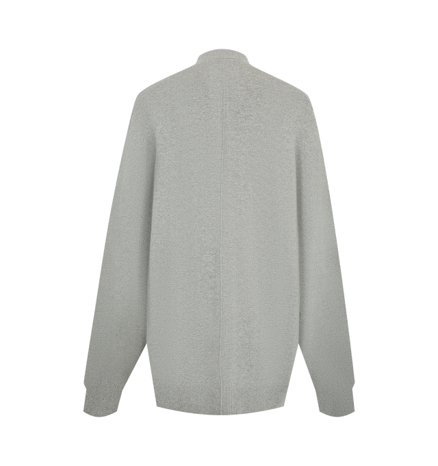 Image 2 of 2 - GREY - Extreme Cashmere Women's N24 Tokio Cardigan Sweater is crafted from a premium cashmere blend and features a relaxed silhouette with dropped shoulders, two front patch pockets, and a unique side button that allows for adjustable styling. This designer cashmere cardigan combines exceptional softness with versatile functionality, while durable natural corozo buttons add a refined finishing touch. Main Material: 88% Cashmere, 10% Nylon, 2% Elastane. 