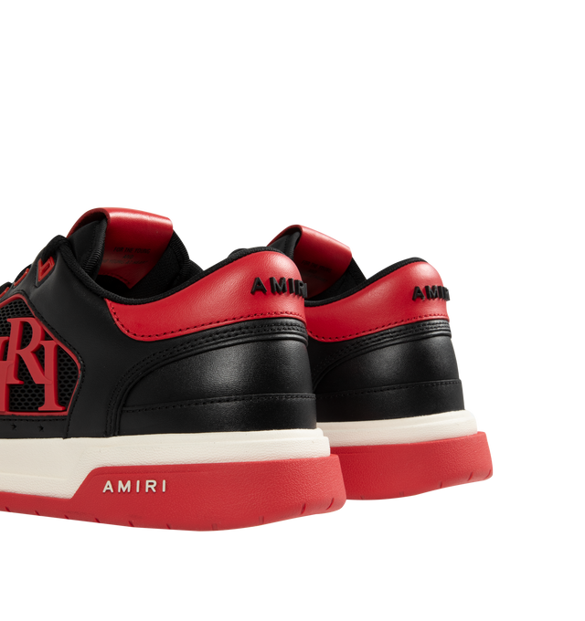 Image 3 of 5 - RED - AMIRI Classic Low Sneakers featuring low-top, buffed leather, graphic perforated detailing throughout, logo bonded at padded tongue, padded collar, rubberized logo appliqu at sides, logo bonded at heel counter and treaded rubber sole. Upper: leather. Sole: rubber. 