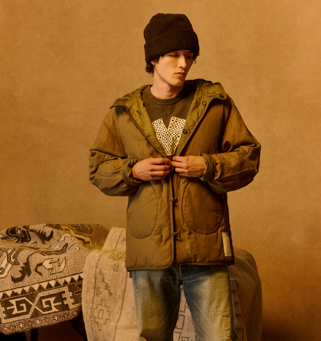 Image 2 of 4 - GREEN - VISVIM Greely Corps Down Parka featuring twill nylon woven down jacket, damaged finish, white goose down fill, custom water buffalo buttons, military label detail, flap button chest patch pocket and hood. 100% nylon. 