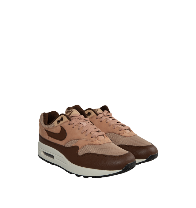 Image 2 of 5 - BROWN - NIKE AIR MAX 1 SC Cacao Wow and Dusted Clay in a rich "Cacao Wow" burgundy-tone mudguard with "Dusted Clay" leather overlays and hemp-hued mesh in the upper.  Featuring leather and mesh upper, air cushioning and rubber outsole, visible Max Air unit in the heel and Nike Air cushioning in the forefoot. The plush foam midsole and padded, low-cut collar add comfort. 