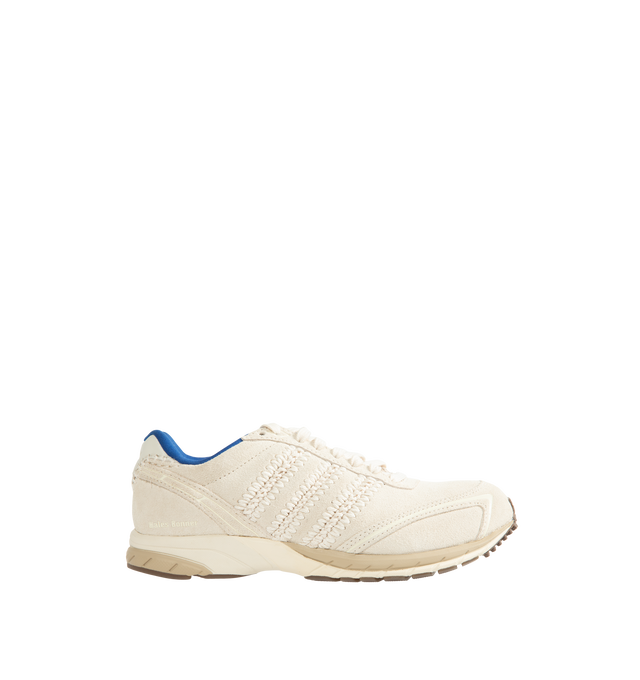 Image 1 of 5 - CREAM - Adidas Originals x Wales Bonner Men's Adizero Adios Suede Shoes blend classic adidas running heritage with Wales Bonner's elevated design perspective. Crafted with a premium leather upper, this refined interpretation of the iconic Adizero Adios silhouette delivers everyday comfort while balancing vintage sport influences with contemporary style. A textile lining enhances comfort, while the durable rubber outsole provides reliable traction for daily wear. Main Material: Leather Upper.  
