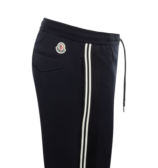 Image 3 of 3 - NAVY - MONCLER Jogging Pants featuring gabardine and wool blend, waistband with drawstring fastening, zipper closure, side slant pockets, back pockets with snap button closure, side striped bands with embroidered logo lettering and logo patch. 54% virgin wool, 45% polyester, 1% elastane/spandex. 