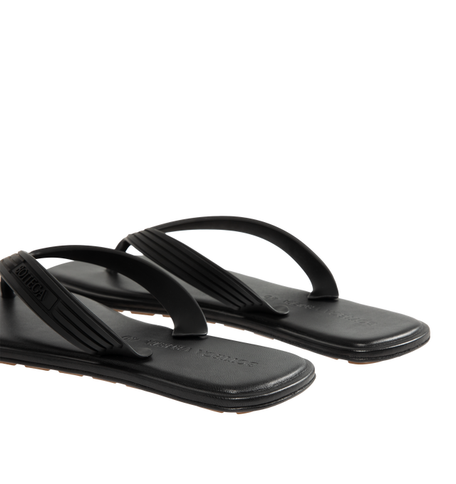 Image 3 of 4 - BLACK - BOTTEGA VENETA Sampieri Thong featuring rubber thong sandal with leather insole. Lining: lambskin. Rubber-injected leather outsole. Thermoplastic polyurethane. Made in Italy.  