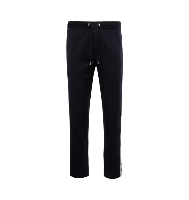Image 1 of 3 - NAVY - MONCLER Jogging Pants featuring gabardine and wool blend, waistband with drawstring fastening, zipper closure, side slant pockets, back pockets with snap button closure, side striped bands with embroidered logo lettering and logo patch. 54% virgin wool, 45% polyester, 1% elastane/spandex. 