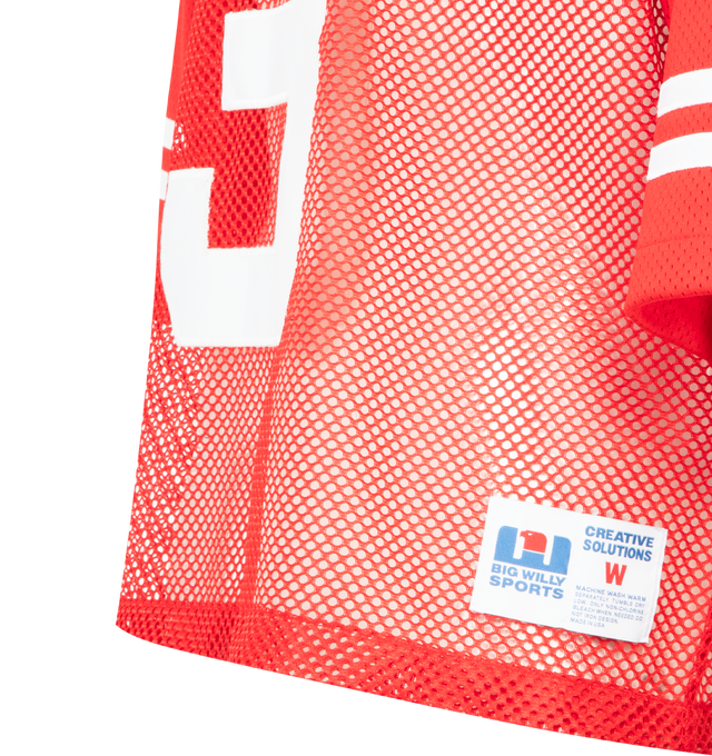 Image 3 of 3 - RED - WILLY CHAVARRIA Willy Football Jersey featuring an athletic-inspired silhouette, cropped cut, oversized fit, dramatic shoulders, zig-zag stitched appliqu graphics, a ribbed V-neck collar and dual-gauged mesh construction. 100% polyester. Made in the USA. 