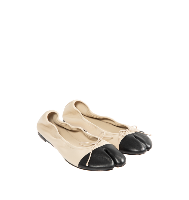 Image 2 of 4 - NEUTRAL - CHRISTEN Tabi Stretch Ballerina Flats featuring grained nappa lambskin, square cleft toe, bow appliqu at vamp, elasticized collar, grained kidskin lining, stacked leather heel with rubber injection and calfskin nubuck sole. Upper: lambskin. Sole: calfskin, rubber. Made in France. 