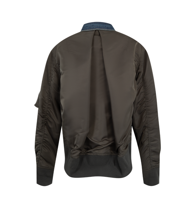 Image 2 of 4 - BLUE - Sacai denim bomber blouson with cotton denim front panel and contrast nylon twill sleeves. Features a classic collar, button-front closure, contrast stitching, patch pockets with flap and button, zip pocket on the sleeve, ribbed hem and cuffs, and back central crease. Outer is 100% cotton denim with 100% nylon sleeves and 100% polyester lining. Made in Japan. 
