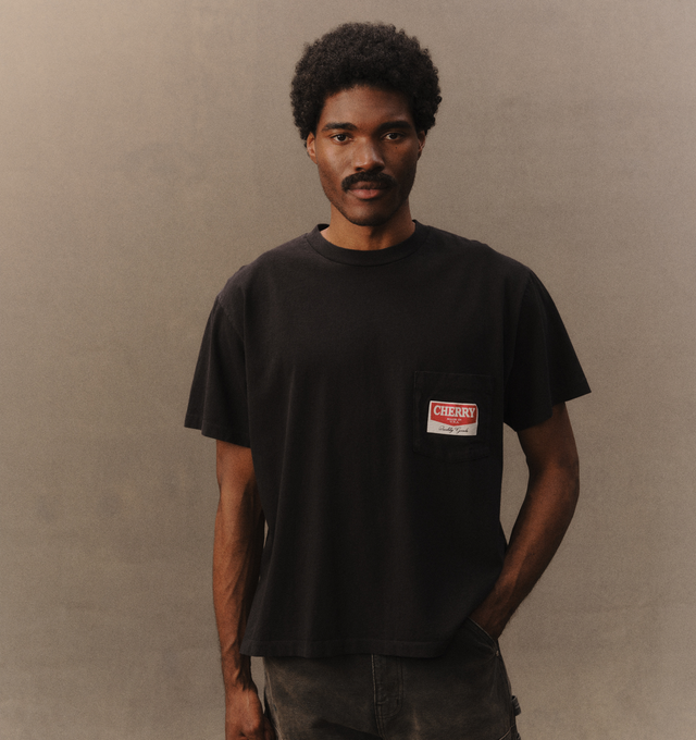 Image 5 of 7 - BLACK - Cherry LA Men's Railroad Boxy Pocket T-Shirt is crafted from cotton and features a boxy-fit silhouette with a classic crew neckline and chest pocket. Designed with screen-printed artwork at the chest pocket and back, this everyday essential combines relaxed proportions with vintage-inspired graphic styling. Main Material: Cotton. Made in Los Angeles, California. 