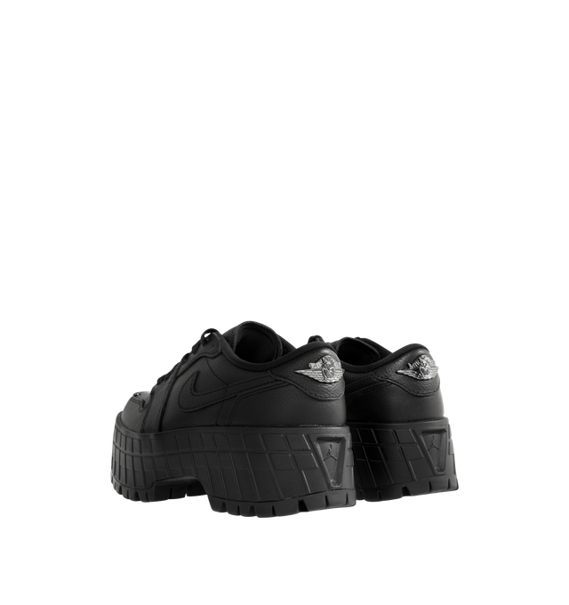 Image 3 of 5 - BLACK - JORDAN Air Jordan 1 Brooklyn Low Sneaker featuring genuine full-grain leather in the upper, Nike Air in the heel, foam midsole, perforated toe box and elevated lugged rubber outsole adds height and extra comfort. 