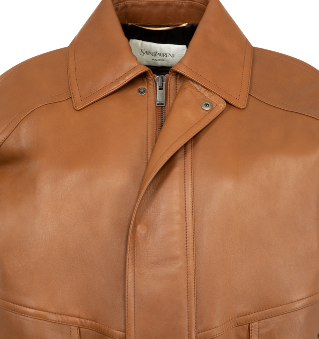 Image 4 of 4 - BROWN - SAINT LAURENT Bomber Jacket in lambskin featuring drop shoulders, a shirred waist, cotton and viscose lining, zip closure with snap-button storm flap, two patch pockets with button flat and two jetted pockets at the front, one inner welt pocket, pointed collar, one-button cuffs and padded shoulders. 100% lambskin. Made in Italy. 