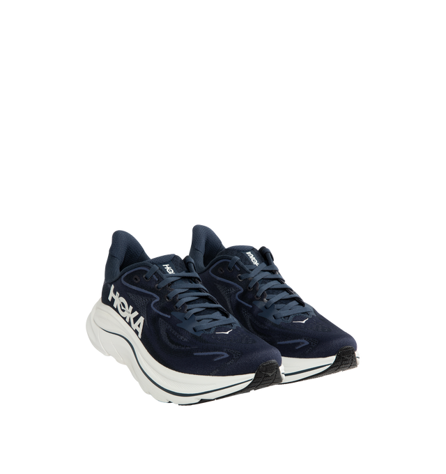 Image 2 of 5 - NAVY - HOKA Clifton 10 Sneaker featuring jacquard knit, reflective upper details, smooth MetaRocker, rearfoot-focused Active Foot Frame, CMEVA midsole, molded EVA sockliner and inherently durable abrasion rubber. 