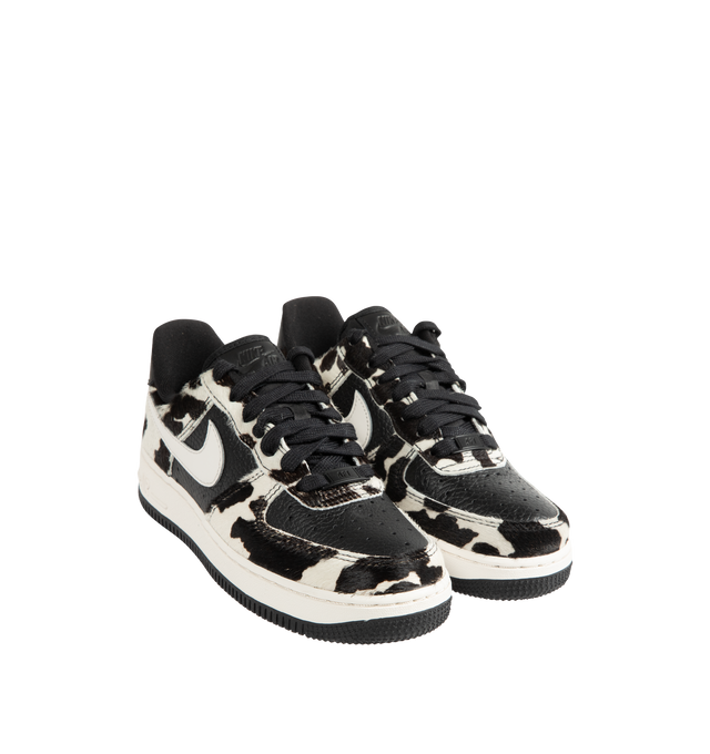 Image 2 of 5 - MULTI - Nike Womens Air Force 1 Low "Cow Print" Sneakers feature a leather upper with cow-print hair overlays. Designed with a lace-up closure, padded collar, perforated toe box, signature Nike Air cushioning, and durable rubber outsole. Upper: Leather with Cow-Print Overlays; Midsole: Nike Air Cushioning; Outsole: Rubber. Imported 