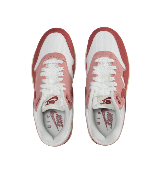 RED - NIKE Air Max 1 '87 Sneaker featuring cushioning that absorbs impact and distributes weight for consistent, buoyant comfort under each step, removable insole, visible Max Air unit in the heel provides clear Air-Sole cushioning and leather and textile upper/synthetic lining/rubber sole.
