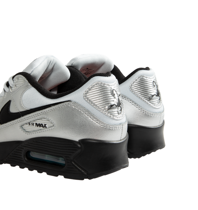 Image 3 of 5 - SILVER - Nike Air Max 90 Premium "Scorpion" Sneakers feature a genuine and synthetic leather upper with layered synthetic overlays, signature Scorpion graphics, and a classic low-top silhouette. Inspired by Nike's Scorpion Pack, these lifestyle sneakers combine visible Max Air cushioning with a durable rubber Waffle outsole for lightweight comfort, reliable traction, and iconic '90s style. Main Material: Genuine Leather, Synthetic Leather, and Synthetic. Midsole: Foam with Visible Max Air U 