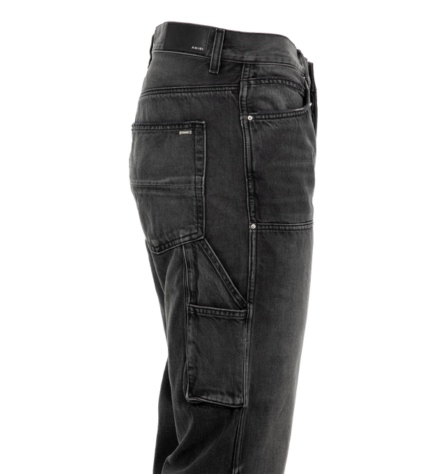 Image 3 of 3 - GREY - AMIRI Carpenter Jeans featuring a baggy silhouette, classic five-pocket style, patch details, side painter strap, belt loops and zip fly, button closure. 100% cotton. 