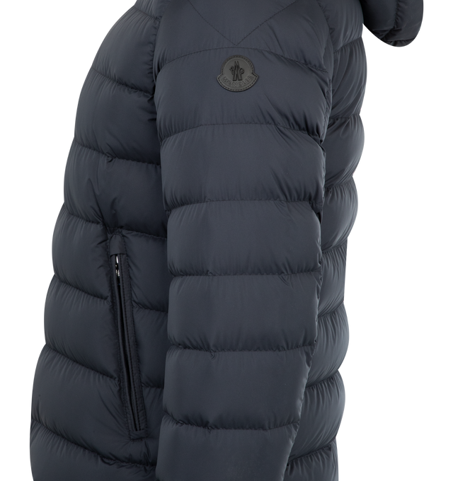Image 3 of 4 - NAVY - MONCLER Arneb Jacket featuring Airsoft lining, down-filled, detachable hood with micro chic lining, zipper closure with leather trim, zipped pockets, adjustable cuffs with snap button closure and leather logo patch. 100% polyester. Padding: 90% down, 10% feather. Made in Italy 