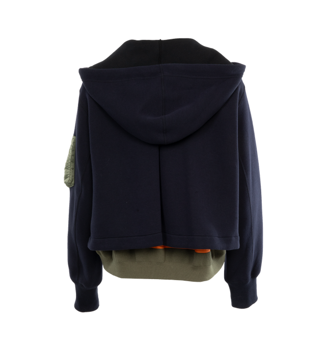 Image 2 of 4 - NAVY - SACAI Sponge Sweat Hoodie featuring drawstring at hood, funnel neck, two-way zip closure, rib knit hem and cuffs and logo-engraved silver-tone hardware. 62% cotton, 38% polyester. Trims: 100% nylon. Made in Japan.  