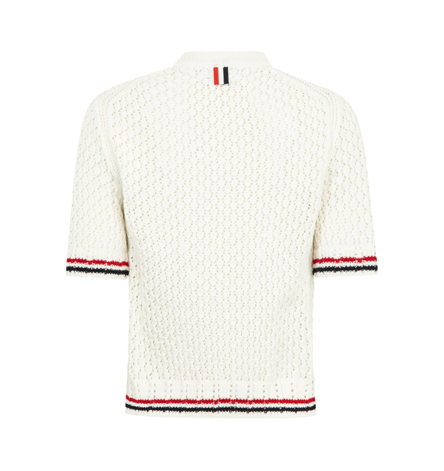 Image 2 of 2 - WHITE - THOM BROWNE Pointelle Stitch Hector Tee featuring Hector rendered in tonal intarsia across the front, open stitch knitwork, ribbed neckline, contrast stitch trim along armholes, ribbed cuffs and hem with RWB tipping and signature striped grosgrain loop tab. 100% cotton. Made in the United Kingdom. 