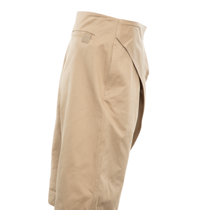 Image 3 of 4 - NEUTRAL - Loewe Shorts crafted in lightweight cotton drill with folded pleats panel at the front. Featuring a relaxed fit, knee length, mid waist, loose leg, side zip fastening, seam pockets, rear welt pocket with Anagram embossed leather tab placed on the rear pocket. 100% cotton. Made in Italy. 