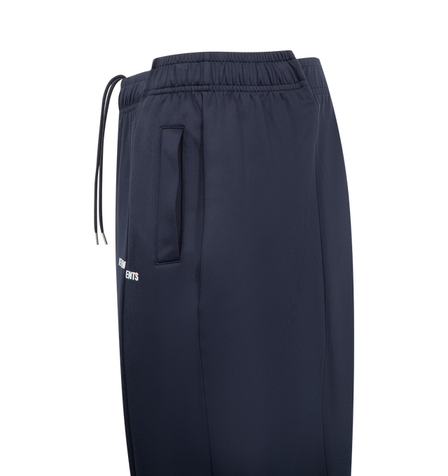 Image 3 of 3 - NAVY - VETEMENTS Cut-Up Athletic Sweatpants featuring paneled construction, concealed drawstring at elasticized waistband, two-pocket styling, logo embroidered at front and asymmetric cuffs. 56% polyamide, 44% cotton. Made in Portugal.  