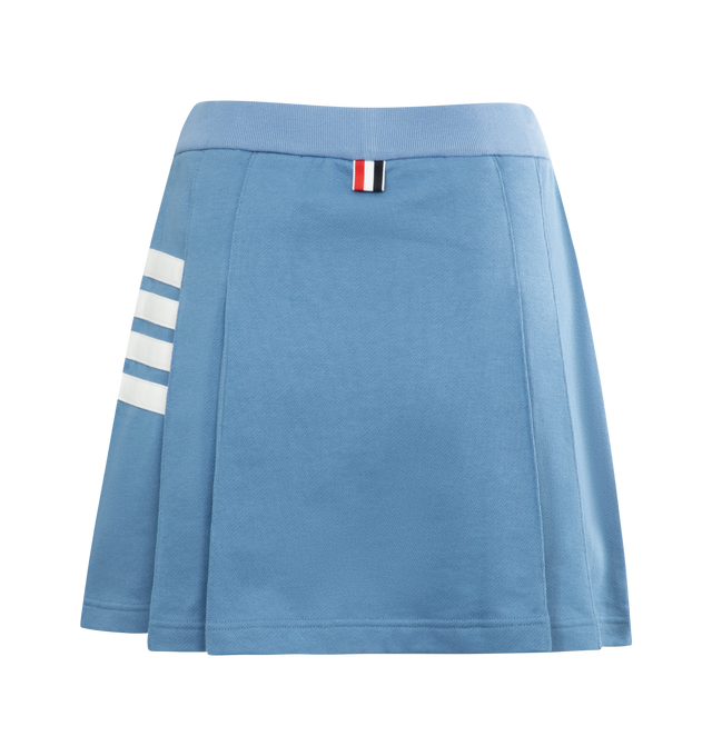 Image 2 of 2 - BLUE - THOM BROWNE Mini Side Pleated Skirt featuring seamed in 4 bar stripe, pleats throughout, rib knit elasticized waistband textile logo patch at hem and tricolor grosgrain flag at back waist. 100% cotton. Made in Italy. 