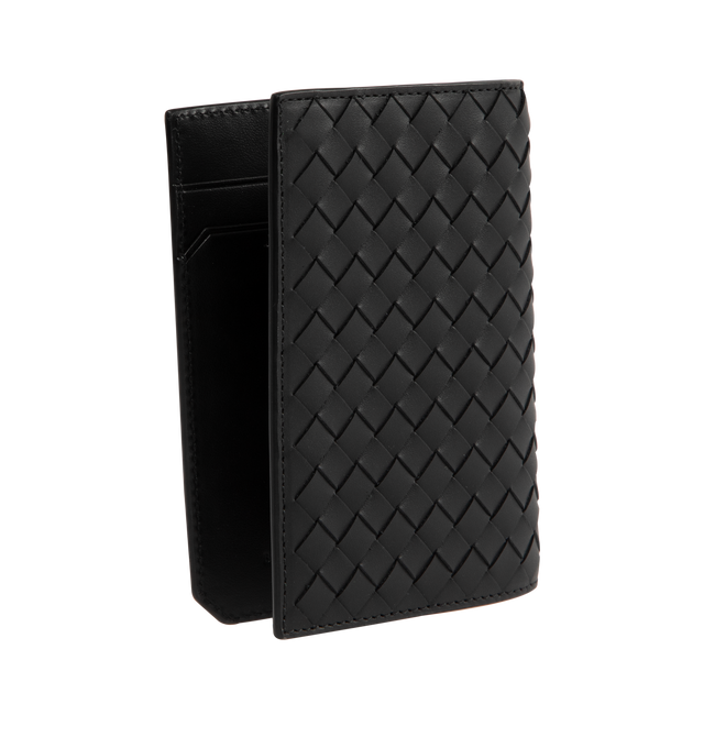 Image 2 of 3 - BLACK - Bottega Veneta Intrecciato Passport Holder has 5-card slots, 2 patch pockets, and a woven exterior design. 100% calfskin leather. H 5.25 X W 3.75 inches. Made in Italy. 