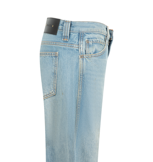 Image 3 of 3 - BLUE - Khaite Women's Karo Jean is crafted from rigid cotton denim and features a low-rise silhouette designed to sit low on the hips, detailed with curved seams that create a bowed leg shape, cuffed hems, classic five-pocket styling, and an antiqued nickel embossed button closure. Main Material: 100% Cotton. Made in USA. 