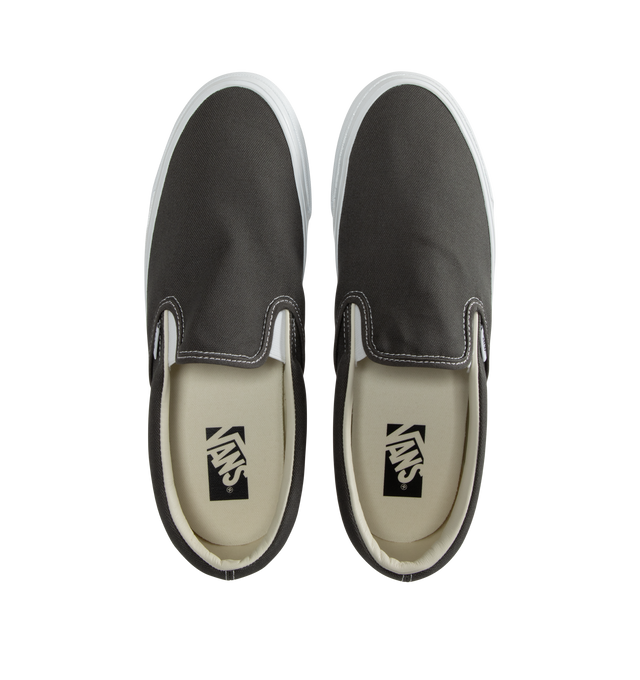 Image 5 of 5 - GREY - Vans slip-on canvas shoes with elastic gores for a flexible fit and logo detailing at quarter, heel, and footbed. Fits true to size. Canvas upper, fabric lining, rubber sole. 