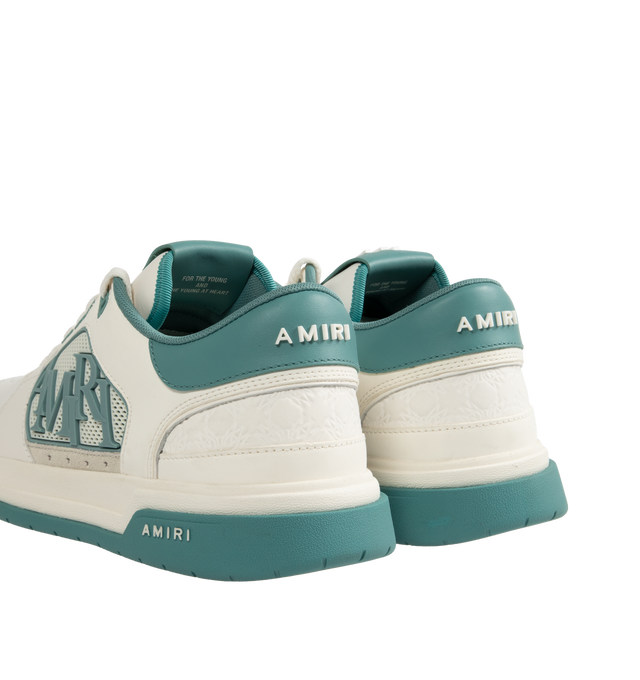 Image 3 of 5 - BLUE - Amiri Men's Classic Low Sneaker is a lace-up style crafted on a rubber sole with leather upper and central panels of molded rubber mesh framing the AMIRI staggered logo. Made in Vietnam. Upper: Leather. Sole: Rubber. 