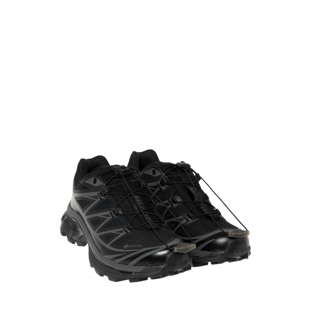 Image 2 of 5 - BLACK - Salomon Men's XT-6 GORE-TEX Sneakers are crafted with a lightweight textile upper and feature waterproof GORE-TEX protection, the brand's Agile Chassis System, and Quicklace technology for a secure, precise fit. Originally developed for ultra-distance trail running, these designer sneakers combine superior cushioning, stability, and all-terrain grip with Salomon's signature technical aesthetic, making them ideal for both outdoor performance and everyday wear. Main Material: Textile an 