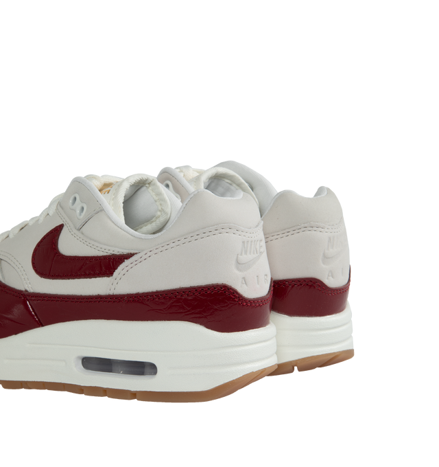 Image 3 of 5 - RED - NIKE Air Max 1 LX featuring classic wavy mudguard, foam midsole, Max Air unit in the heel, rubber waffle outsole and padded, low-cut collar. 