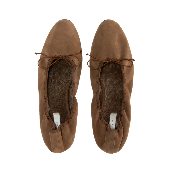 Image 4 of 4 - BROWN - THE ROW Awar Heeled Ballerina featuring heeled ballet flat in shearling-lined suede with oval toe, grosgrain piping, and adjustable elastic tie. 1 in. heel. 100% goatskin leather. Leather sole. Made in Italy. 