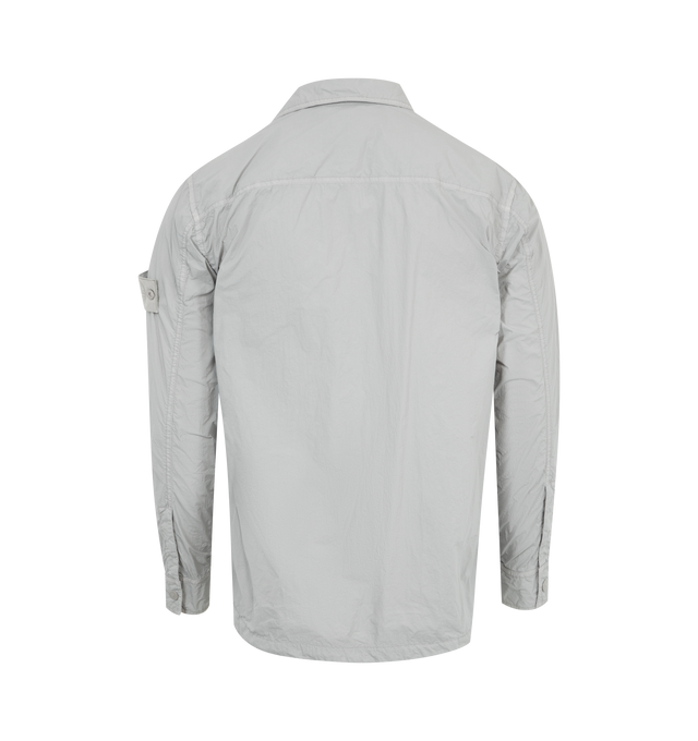 Image 2 of 3 - GREY - Stone Island Ghost Overshirt featuring concealed press-stud fastening, chest flap pocket, press-stud fastening cuffs and signature detachable Compass badge. 100% polyamide. 