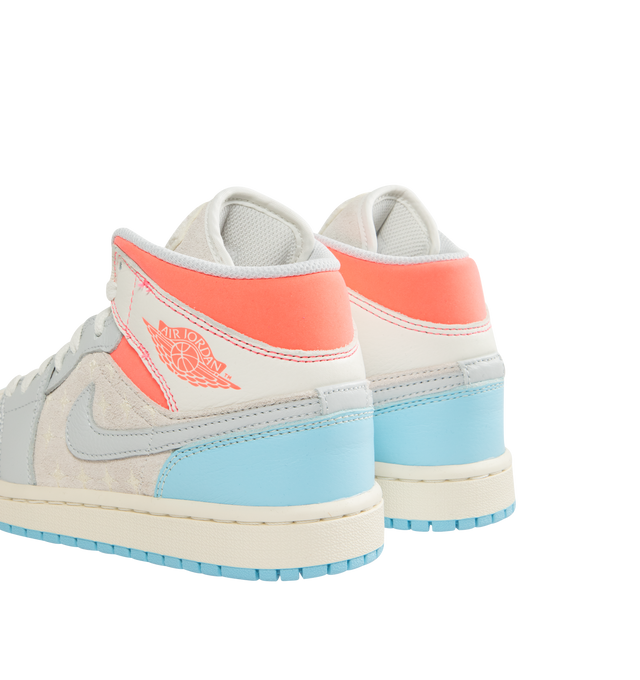 Image 3 of 5 - BLUE - JORDAN Air Jordan 1 Mid Sneaker featuring leather, synthetic leather and textile upper, foam midsole, Nike Air cushioning and rubber outsole with pivot circle. 