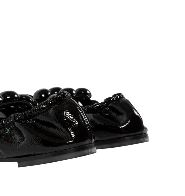 Image 3 of 4 - BLACK - Alaia Sphere Strap Ballet Flats feature leather-covered half spheres, double elastic straps, and rubber soles. 100% calf leather. Made in Italy.  