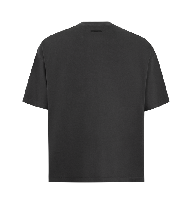 Image 2 of 2 - BLACK - FEAR OF GOD ESSENTIALS Campus 90s Tee featuring heavyweight cotton jersey, pigment dyed, crewneck, 90s fit with oversized proportions and dropped shoulders, campus puff-print graphic on front and Fear of God Essentials label at the back neckline. 100% cotton. 