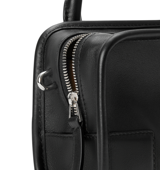 Image 10 of 11 - BLACK - Loewe Mini Amazona 180 Bag in leather features a relaxed silhouette anchored by a single toron top handle, designed to be carried open, while a concealed closure secures the main compartment, removable shoulder and crossbody straps, two carry options: short handle, removable and adjustable crossbody strap, zip closure with two leather zip pullers, two compartments, main compartment closed with magnetic closure, left side d-ring for customization, suede and nappa lambskin lining, and 