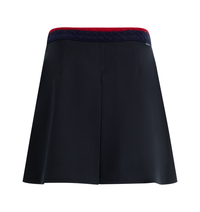 Image 2 of 4 - NAVY - MONCLER Pleated Mini Skirt featuring stretch cotton gabardine, striped braided waistband, side zipper closure and pleated. 98% cotton, 2% elastane/spandex. 